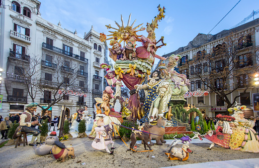 General view of a Falla during Las Fallas Festival on March 16, 2018 in Valencia, Spain. The Fallas is Valencias most international festival, which runs from March 15 until March 19 and celebrates the arrival of spring with fireworks, fiestas and bonfires made by large puppets named Ninots. During the months preceding this unique festivity, a lot of hard work and dedication is put into preparing the monumental and ephemeral cardboard statues that will be devoured by the flames. The festival has been designated as a UNESCO Intangible Cultural Heritage of Humanity since 2017. People look the falla.