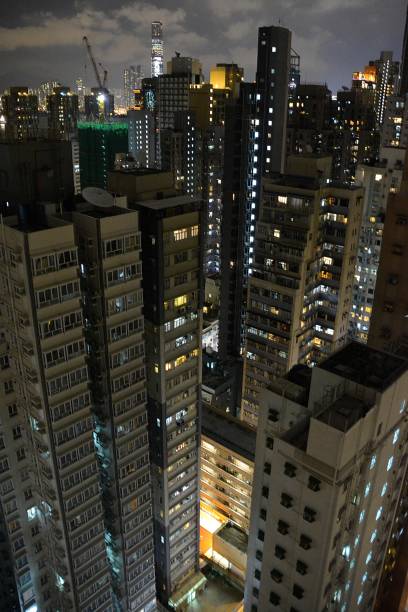 istock Hong Kong residential buildings by night 935331126