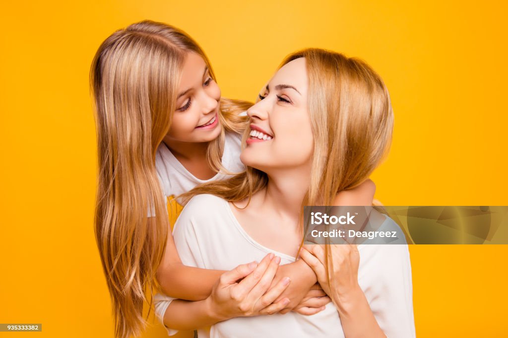 Blond joy enjoy holiday laughter joke two people concept. Close up portrait of charming cute sweet lovely adorable beautiful carefree playful with toothy smile mom mum mummy kid isolated on background Mother Stock Photo