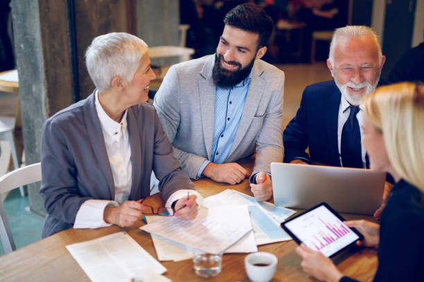 istock Mixed age business team is having a meeting in a cafe 935334846