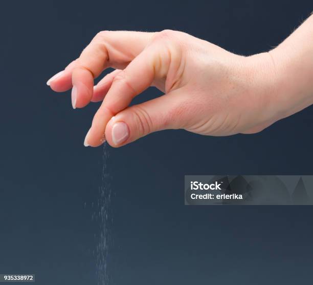 Hand Sprinkling Salt Stock Photo - Download Image Now - Salt - Seasoning, Sprinkling, Pinching