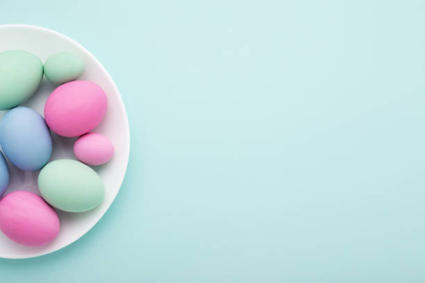 istock Minimal Easter card of eggs & plate on blue 935341202