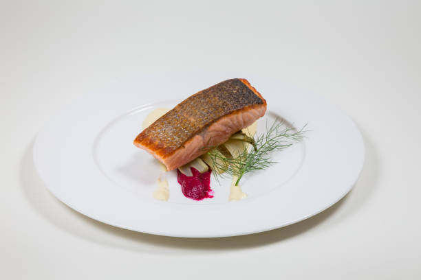 istock Salmon Steak on a white plate on a white background 935343414