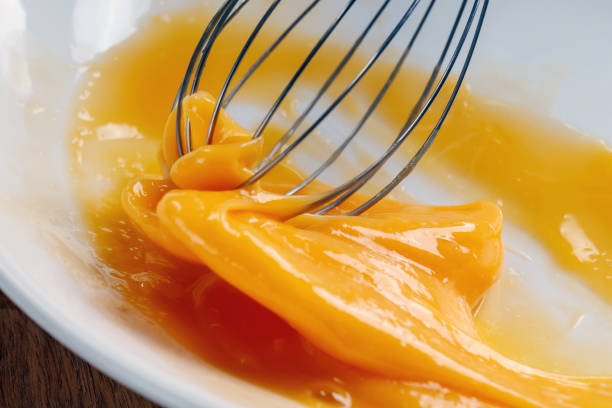 istock Whipping egg whisk. The concept of using eggs in the recipe Macro. 935346344