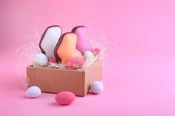 istock Candies in shape of easter bunny and chocolate egg in the box. 935346942