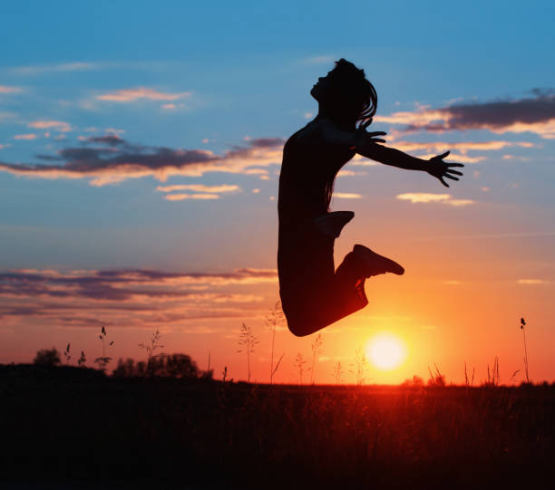 istock Young women joyfully jumping at sunset 935350870