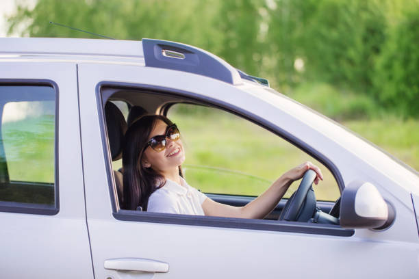 istock happy woman in car 935350950