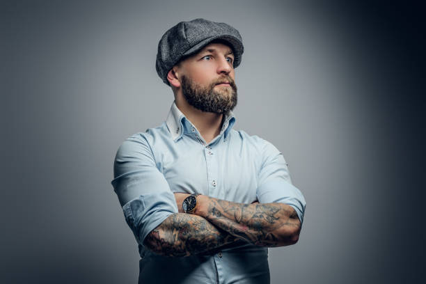 istock Bearded male in a shirt and tweed cap. 935355810