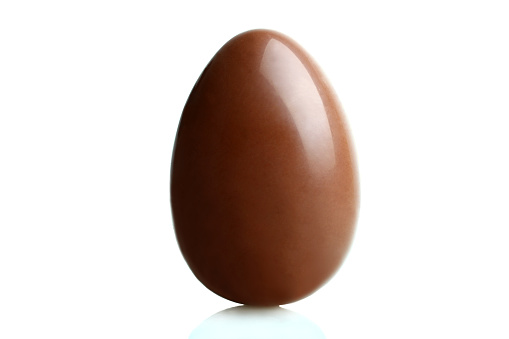 One chocolate egg is isolated on a white background.