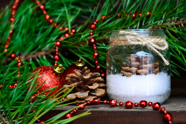 istock Candle on the table near the Christmas tree. Christmas present 935359878