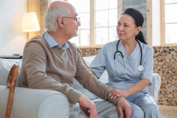 istock Beautiful doctor consulting senior man 935366358