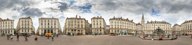 Spherical fisheye panorama as little planet of town square Place Royale in the shopping center of Nantes, France, on a summer day with the Basilique Saint-Nicolas de Nantes in the background