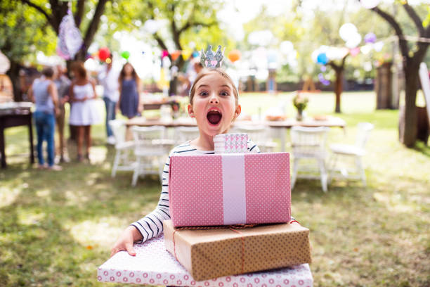 Family celebration or a garden party outside in the backyard. Family celebration outside in the backyard. Big garden party. Birthday party. birthday present stock pictures, royalty-free photos & images