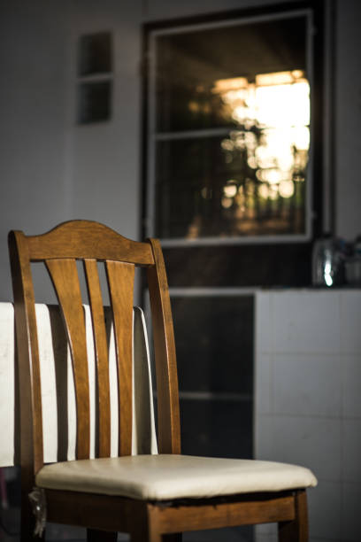 istock Wood dinner chair in house and sunlight on sunset. 935374072