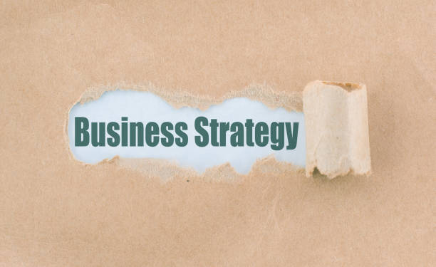 istock Letter Business Strategy Written Behind Torn Paper 935380448