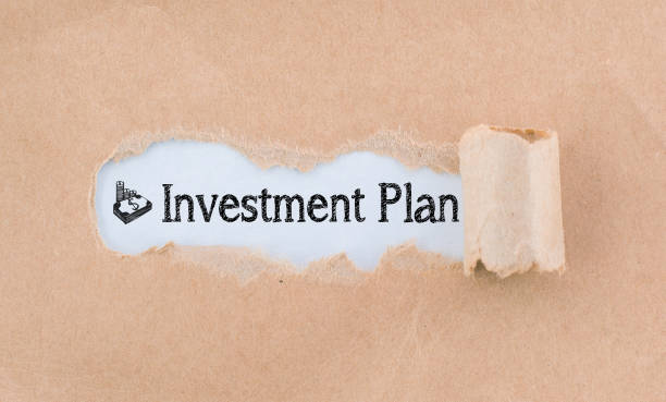 istock Letter Investment Plan Written Behind Torn Paper 935380504
