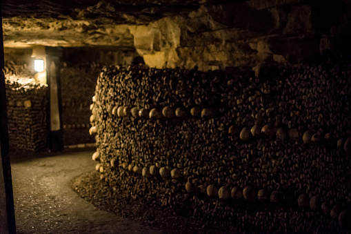 27th of September 2017, Paris, France, Skulls and bones stacked up in the hallways of catacombs of Paris