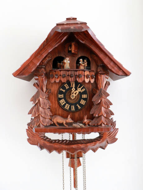 istock Brown Ornamental Handmade Cuckoo Clock from the Black Forest, Germany (on White Background) 935390154