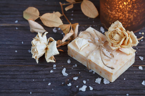 istock Composition of spa treatment. Natural handmade soap with fragrant herbs. Spa concept. 935390182