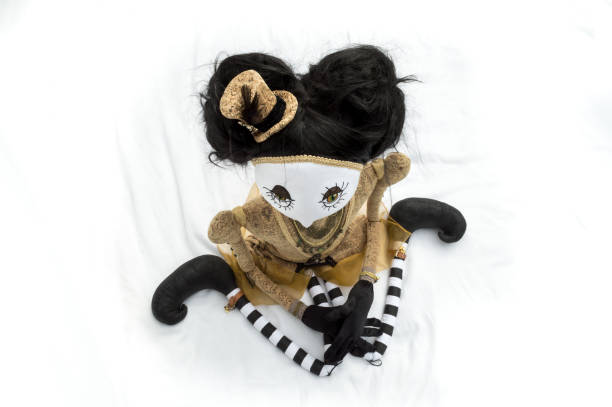 istock Creepy steampunk doll sitting, kneeling. High angle view. 935394866