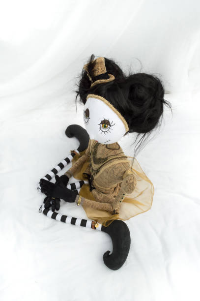 istock Creepy steampunk doll sitting, kneeling. High angle view. 935394962