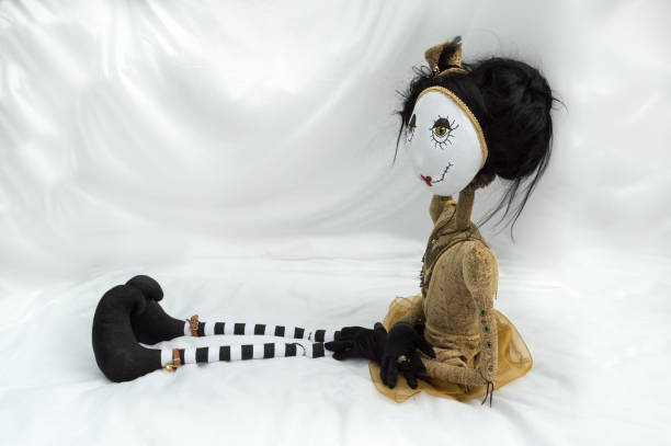 istock Creepy steampunk doll sitting with legs outstretched. 935395006