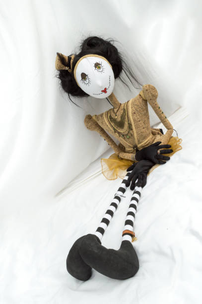 istock Creepy steampunk doll sitting with legs outstretched. Vertical. Tilted. 935395062