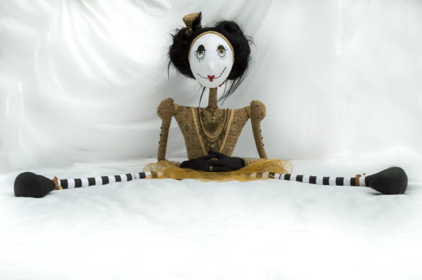 istock Creepy steampunk doll sitting with legs wide apart. 935395356