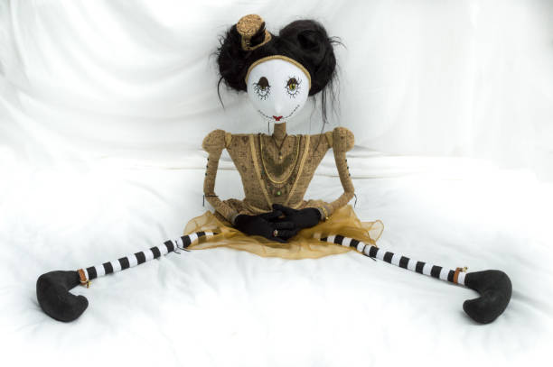 istock Creepy steampunk doll sitting with legs wide apart. 935395412