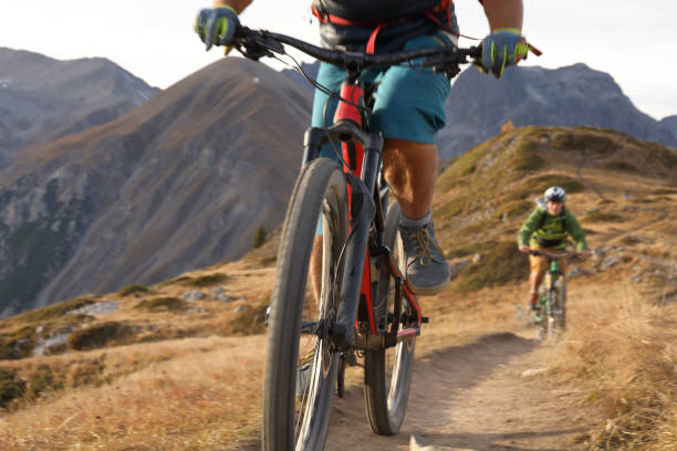 istock Two men cycle along ridge on trail 935395504