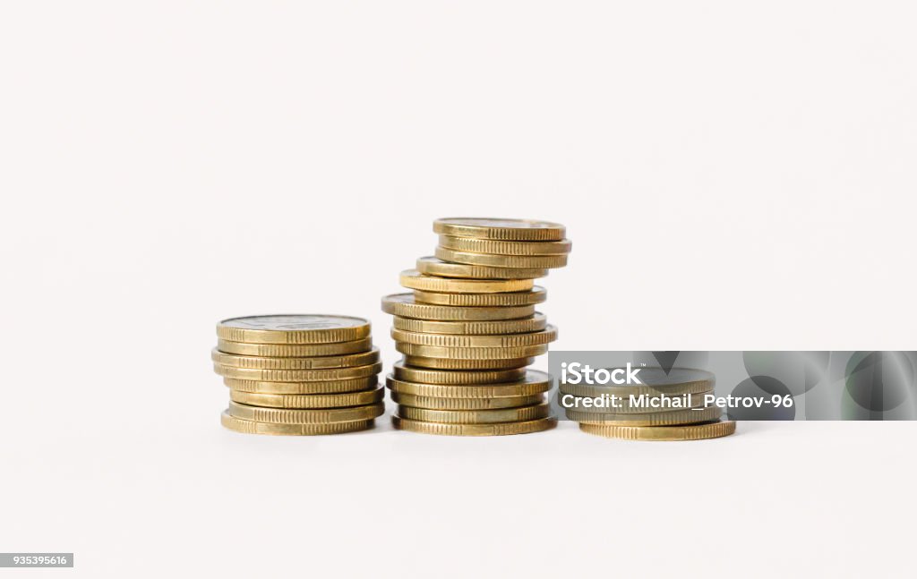 Rows of coins isolated on white background. Finance and banking concept. Coin Stock Photo