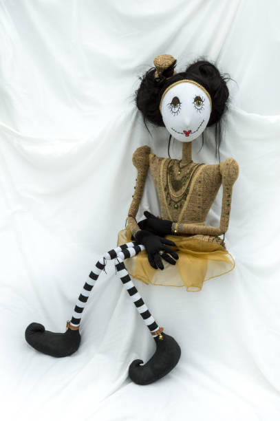 istock Creepy steampunk doll sitting facing forward. Side view. Vertical. 935395660