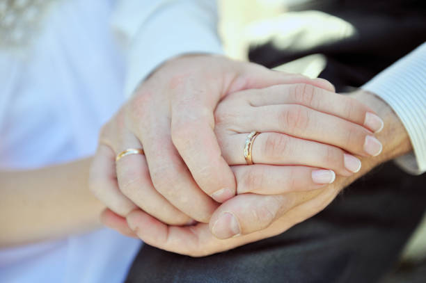 istock Hands of  pair with a beautiful wedding ring 935396274