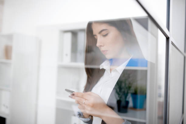 istock Serious business lady reading sms 935400892