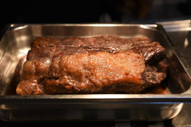 istock cooked and resting a whole joint of roast beef 935401174