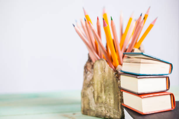 istock Pile of various books on wooden background 935401914