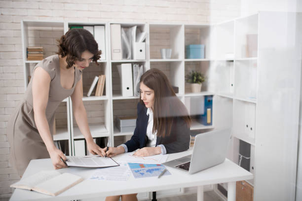 istock Pensive business lady signing contract in office 935401938