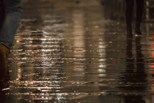 istock People walking in the rain 935404274