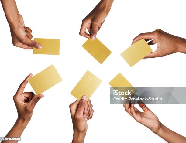 Black Male Hand With Golden Business Cards Set Isolated On White Stock Photo - Download Image Now
