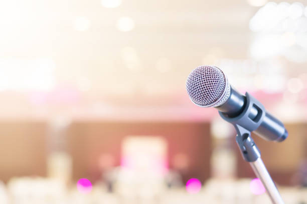 istock Microphone in conference on seminar room event background 935406206