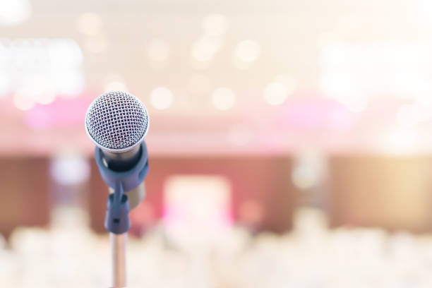 istock Microphone in conference on seminar room event background 935406210
