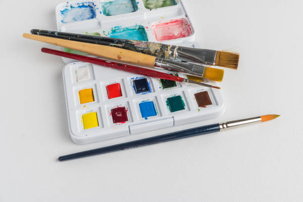 istock Box of watercolor paints and brushes 935407028