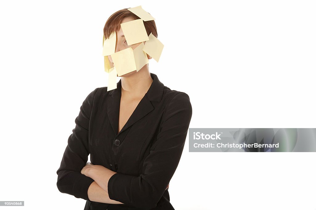 Mujer de negocios con notas adhesivas en la cara - Foto de stock de 20-24 años libre de derechos
