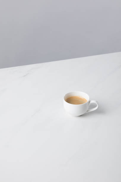 istock View of cup with coffee on white surface 935410958