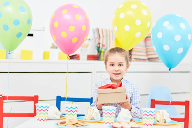 istock Girl by festive table 935411110