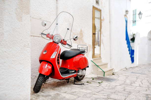 istock Ostuni, Apulia, Italy - red scooter in an alleyway 935415580