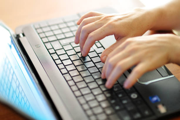 istock female hands typing on a laptop pc keyboard 935416590