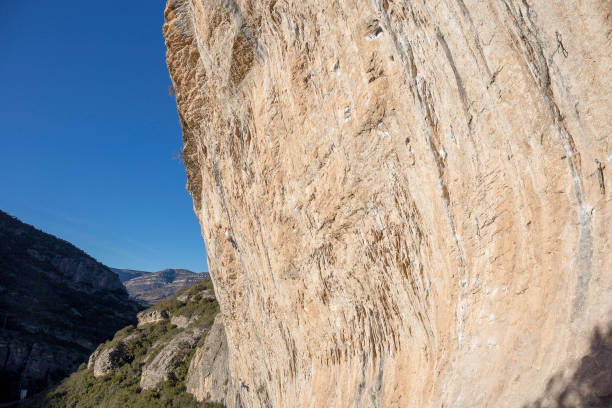 A Japanese woman enjoying free climbing under the blue sky its wonderful landscape.