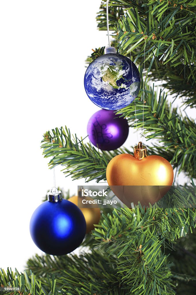 Earth decoration hanging on christmas tree  Celebration Stock Photo