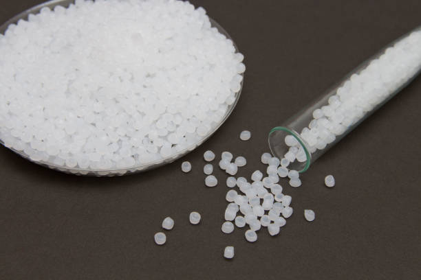 istock Transparent Polyethylene granules.Plastic granules. Plastic Raw material in pellets.High Density Polyethylene (PE-HD).PE-LD 935421470